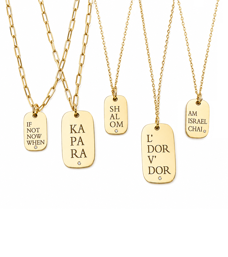 Close-up of meaningful message on statement charm necklace