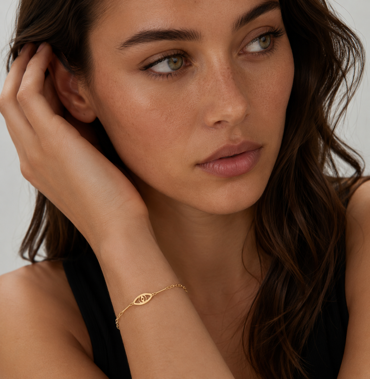 Woman wearing a delicate Evil Eye Anklet