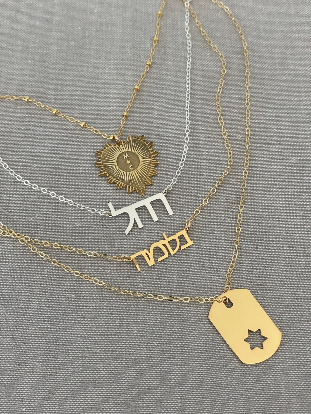 Close-up of Star of David ID tag pendant