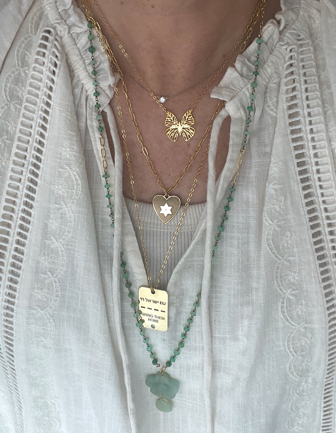 Woman wearing a delicate Filigree Butterfly Necklace